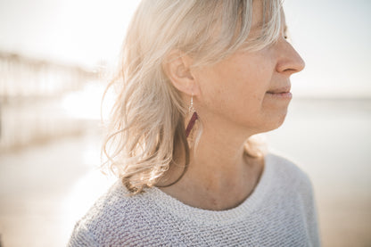 a woman with a hair dryer in her hair 