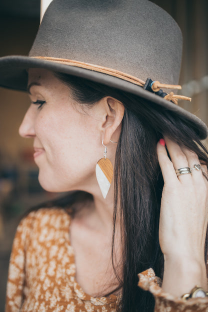 a woman wearing a hat and a hat 