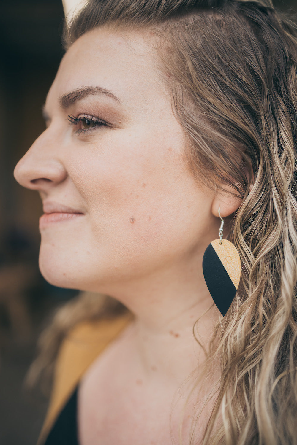 a close up of a woman talking on a cell phone 